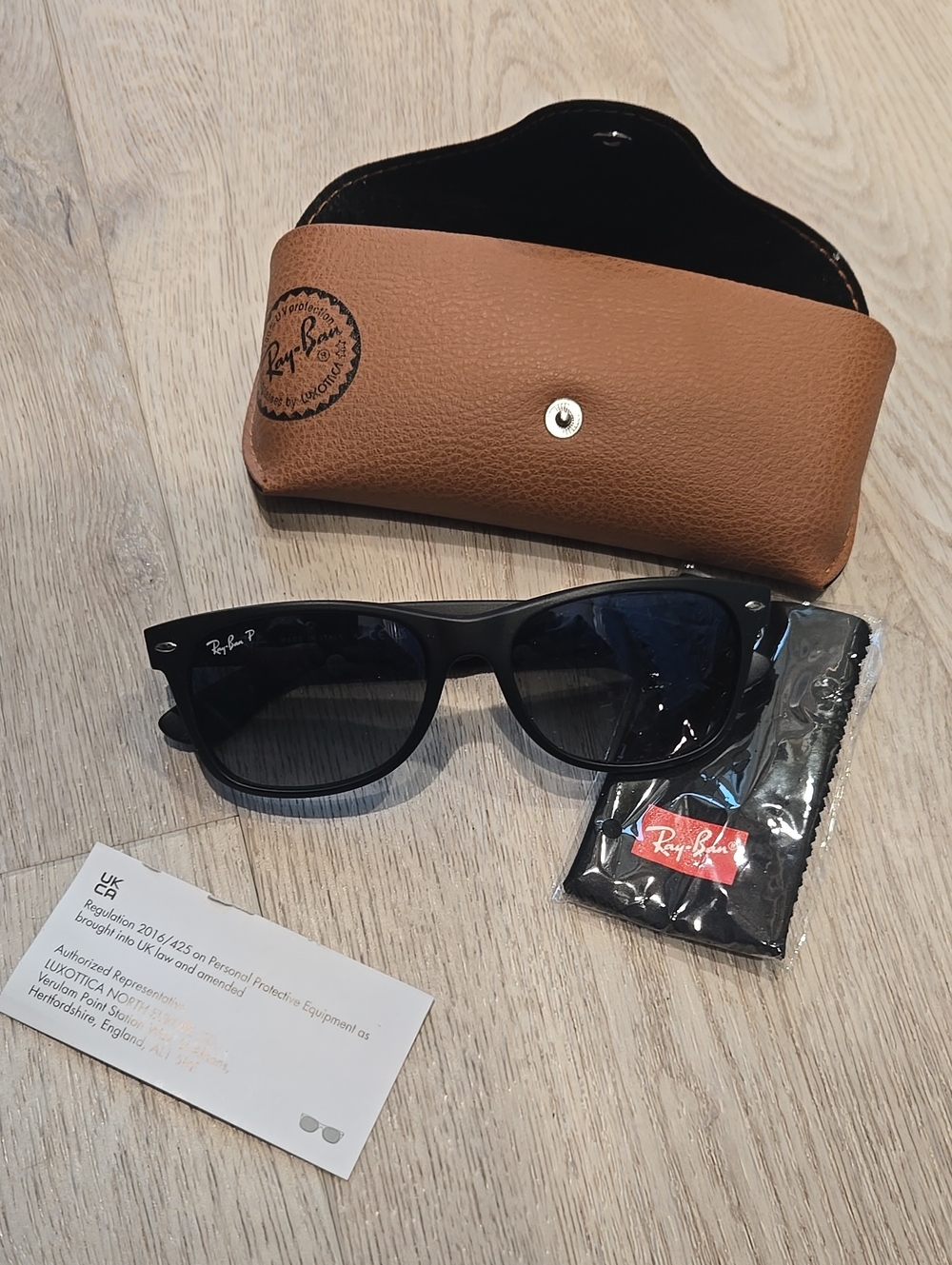 Ray-Ban Black Frame Sunglasses with Dark Lenses